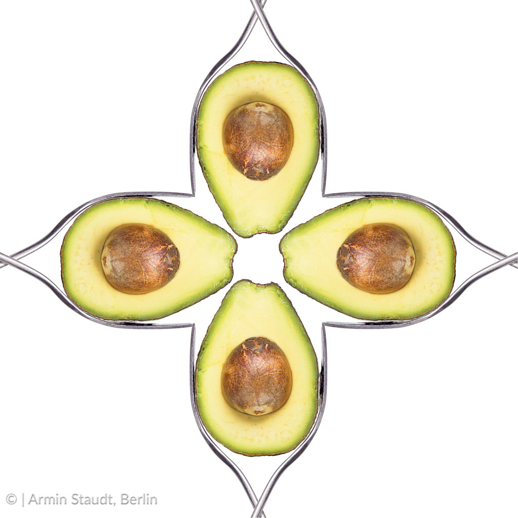 four halfs of avocados formed to a square, isolated on white